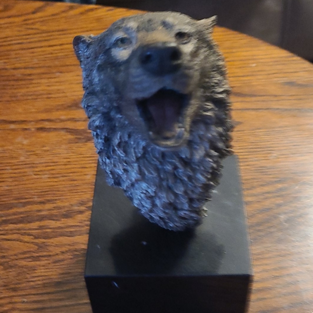 Sculpture of a wolf head.